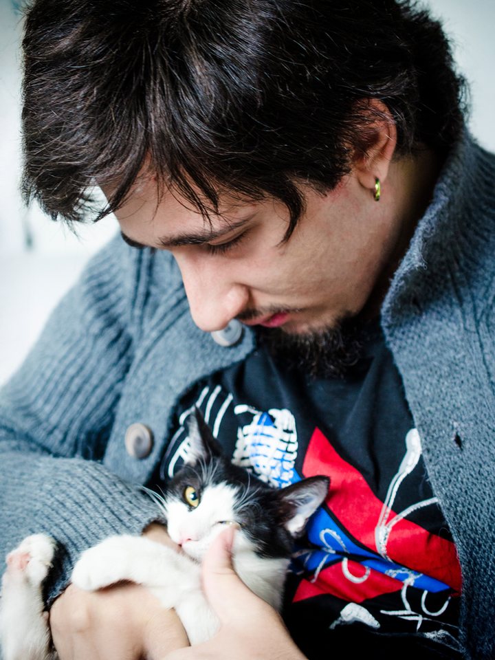 Miabeyefendi holding Mia, a black and white cat